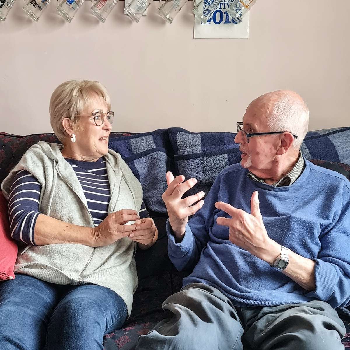 Befriending Scheme - one of our Volunteer Befrienders chatting on the sofa with a local resident
