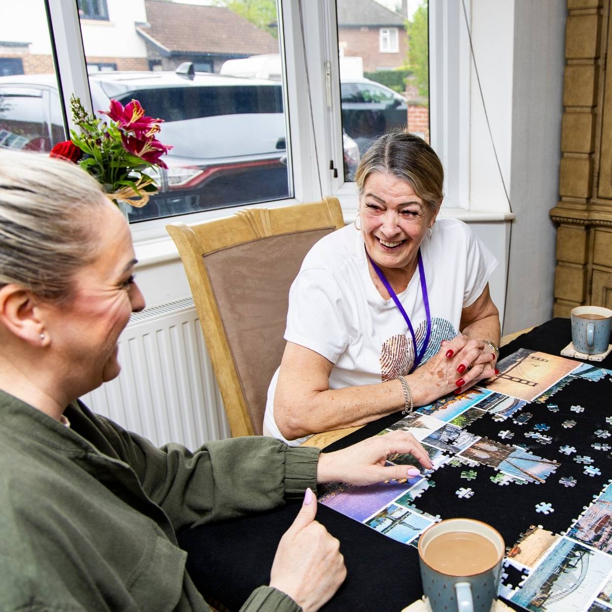 One of our Befriender Volunteers, doing a jigsaw with her match