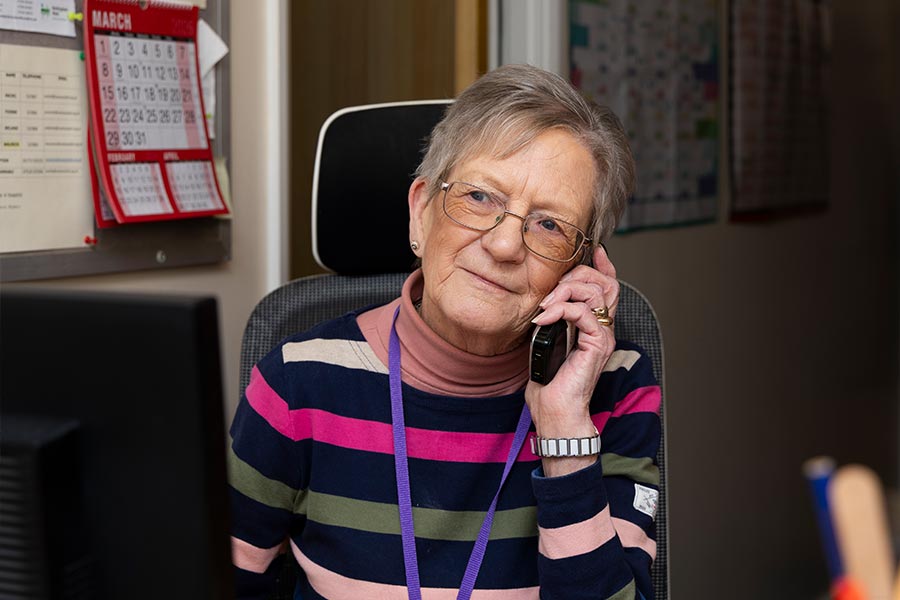 Maureen, our Befriending Coordinator chatting on the phone to a potential Befriender