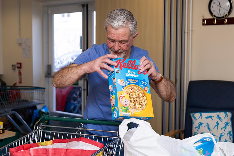 One of our Food Bank Volunteers packing bags for our Friday Food Bank