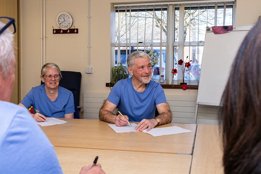 Some of our team and Volunteers having a meeting in our large meeting room