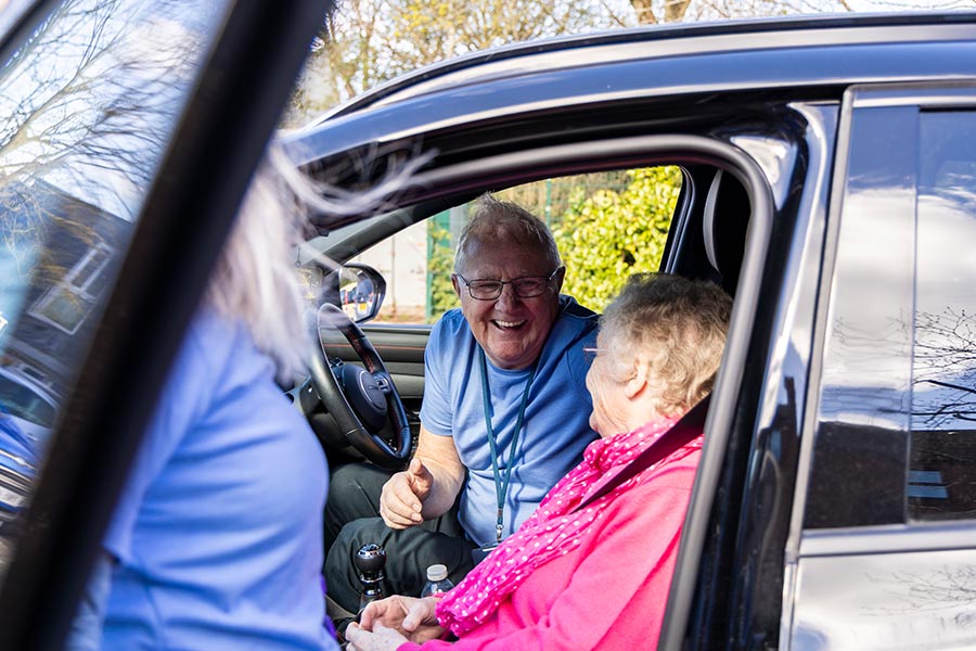 A Volunteer Driver chatting in the car to a user of our Transport Scheme