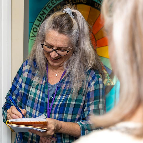 A member of the team taking details of a cash donor