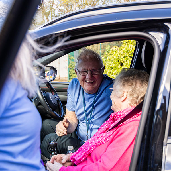 A Volunteer Driver chatting in the car to a user of our Transport Scheme